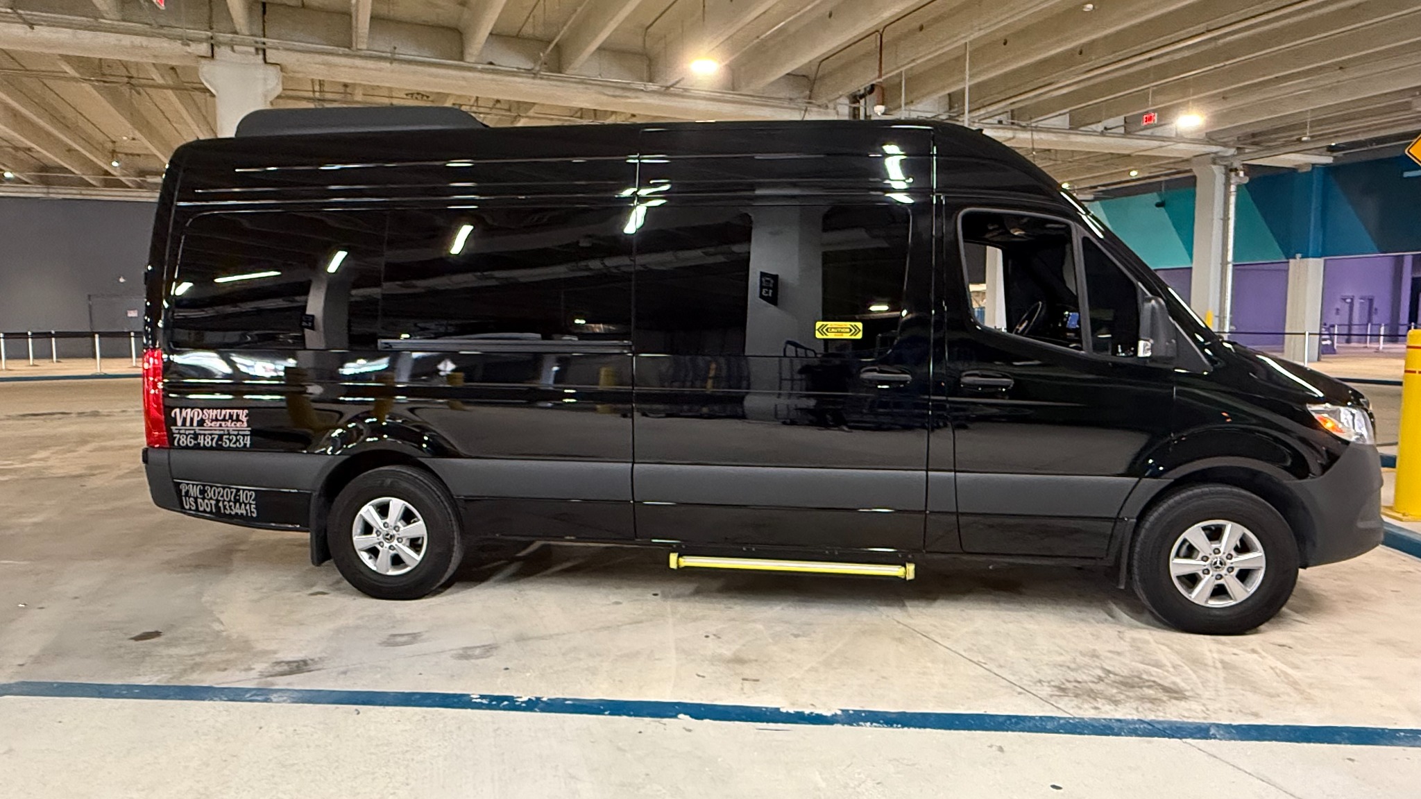 VIP Shuttle Services black Mercedes-Benz Sprinter, full side view